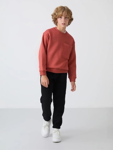 Tommy Life Trainingspak 'TOMMY Kinder Active Set' in Rood: voorkant