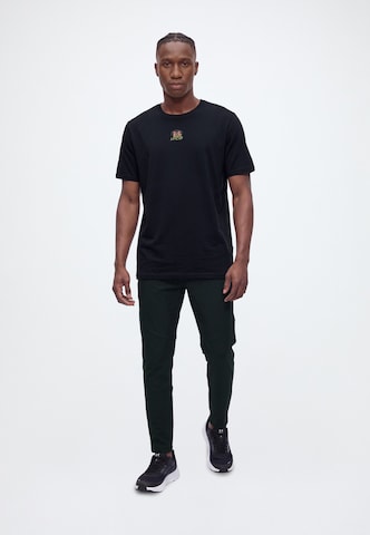 UNDER ARMOUR Koszulka funkcyjna w kolorze czarny