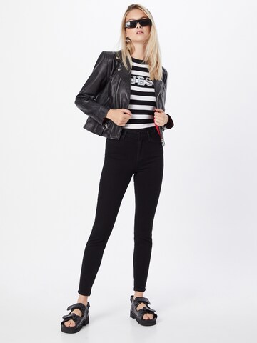 Skinny Jeans de la GUESS pe negru