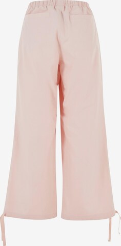 Loosefit Pantaloni di Karl Kani in rosa