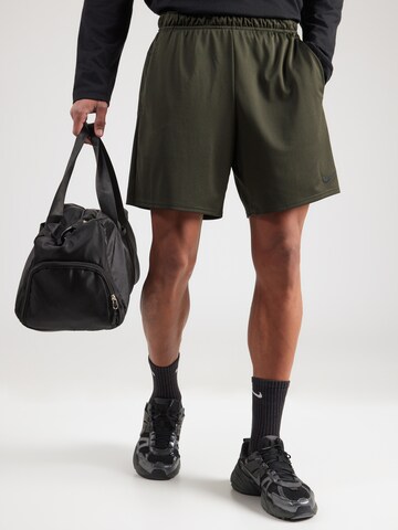 NIKE Regular Workout Pants 'FLEX' in Green: front