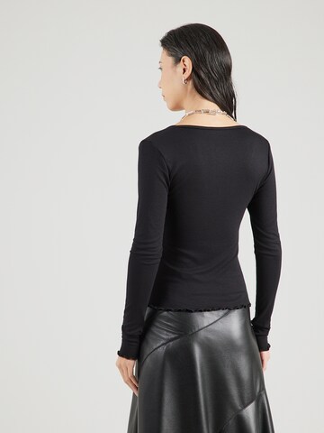 Tricou 'Ines' de la ABOUT YOU pe negru