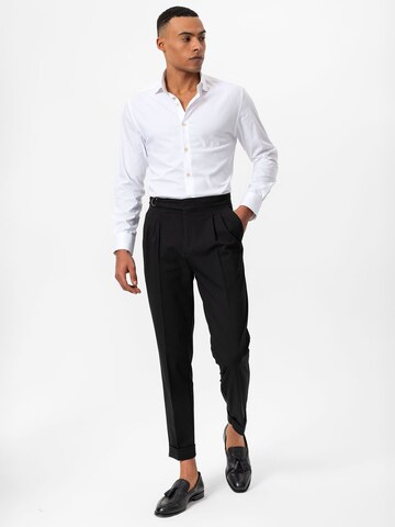 Antioch Tapered Pleat-front trousers in Black