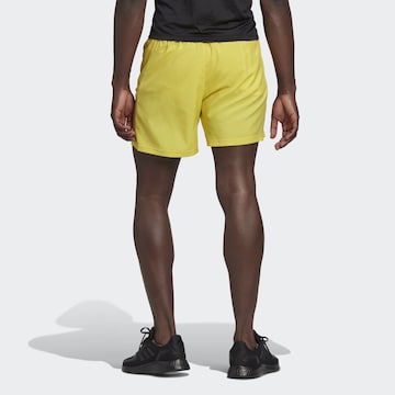 ADIDAS SPORTSWEAR Regular Workout Pants 'Own the Run' in Yellow