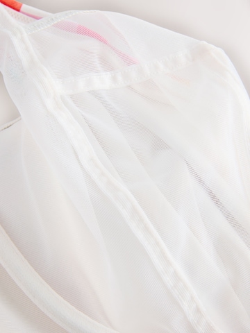 Next Сутиен със смаляващ ефект Горнище на бански в бяло