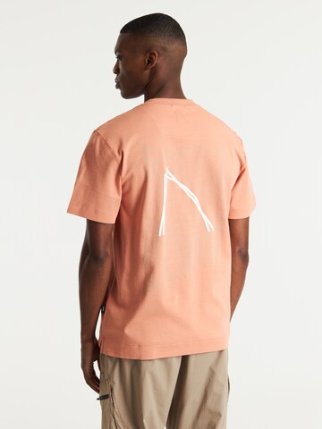 T-Shirt 'Swirl' CHASIN' en orange