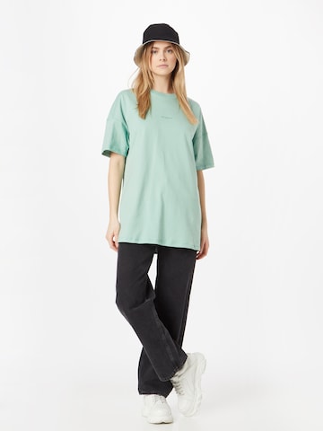 Maglia extra large di new balance in verde