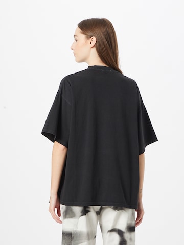 Goldgarn T-Shirt in Schwarz