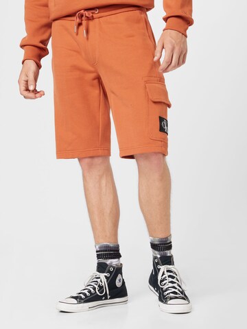 Calvin Klein Jeans Regular Trousers in Orange: front