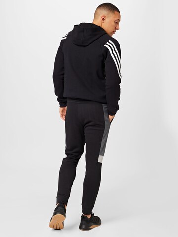 ADIDAS SPORTSWEAR Tapered Workout Pants 'Essentials Colorblock' in Black