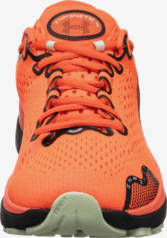 Chaussure de course 'HOVR Infinite 4' UNDER ARMOUR en rose