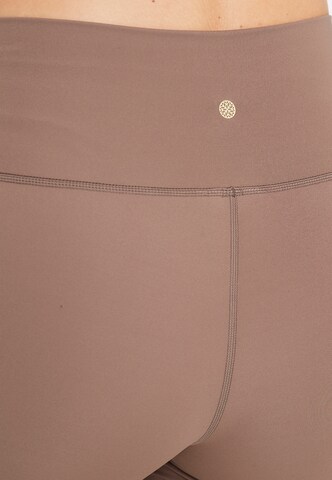 Athlecia Skinny Sportbroek 'Almy' in Bruin