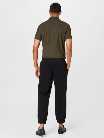 Effilé Pantalon de sport Lacoste Sport en noir