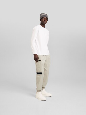 Bershka Tapered Cargo trousers in Beige