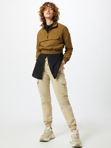 Effilé Pantalon cargo Urban Classics en beige