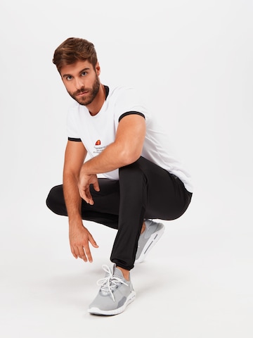 ELLESSE - Slimfit Pantalón deportivo en negro