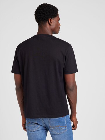 Maglietta di GUESS JEANS in nero