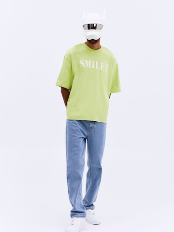 zaļš Smiles T-Krekls 'Kalle': no priekšpuses