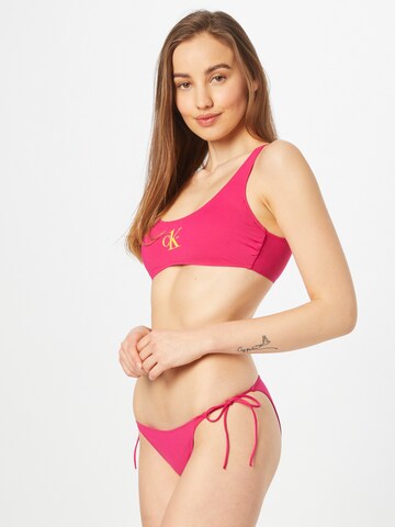 Calvin Klein Swimwear Bygelfri Bikiniöverdel i rosa