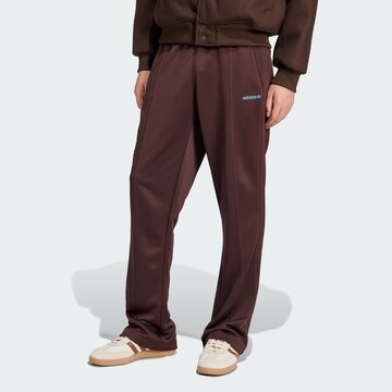 ADIDAS ORIGINALS Flared Trousers in Brown: front