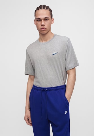 Nike Sportswear Tapered Housut 'CLUB' värissä sininen