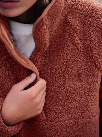 Pull-over self. en marron