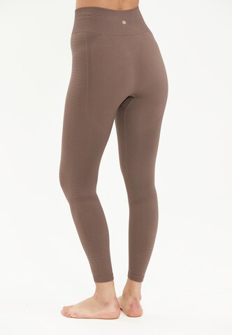 Athlecia Skinny Sportbroek 'NAGAR' in Bruin