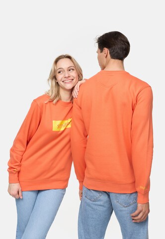 smiler. Sweatshirt in Oranje: voorkant