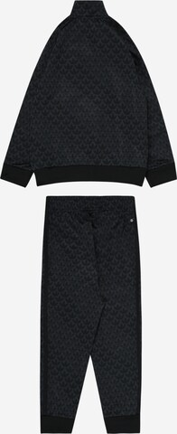 ADIDAS ORIGINALS Jogging ruhák 'Monogram Print' - fekete