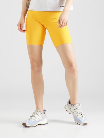 Girlfriend Collective Skinny Workout Pants in Yellow: front