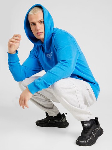 Tommy Jeans Sweatshirt 'ESNTL' in Blue