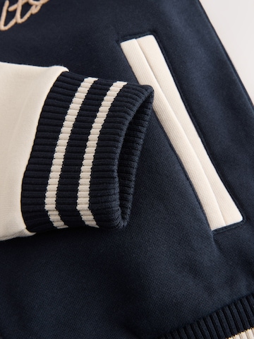 Next Tussenjas in Blauw
