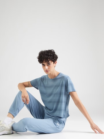 UNDER ARMOUR - Tapered Pantalón deportivo en azul