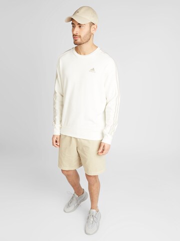 ADIDAS SPORTSWEAR Urheilullinen collegepaita 'Essentials' värissä valkoinen