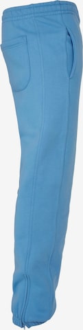 Tapered Pantaloni di Urban Classics in blu