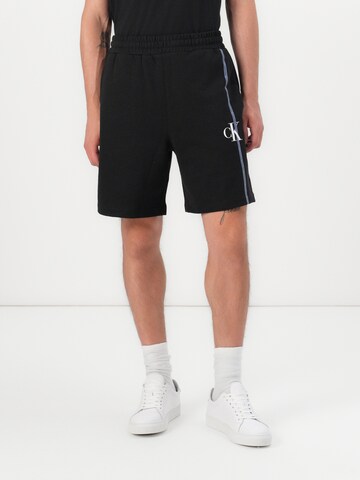 Calvin Klein Regular Trousers in Black: front