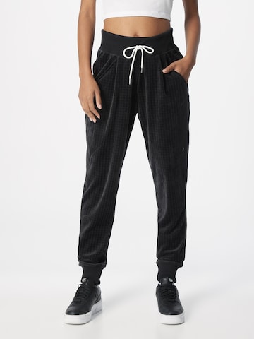 Nike Sportswear Tapered Pleat-Front Pants in Black: front