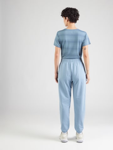UNDER ARMOUR - Tapered Pantalón deportivo en azul