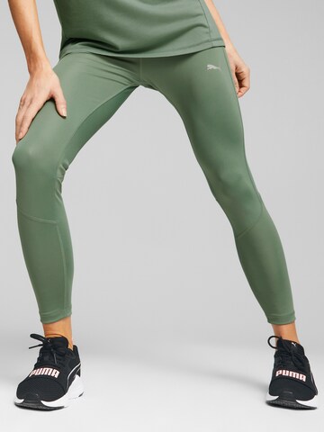 PUMA Skinny Workout Pants 'EVOSTRIPE' in Green: front