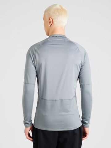 NIKE Funktionsshirt in Grau