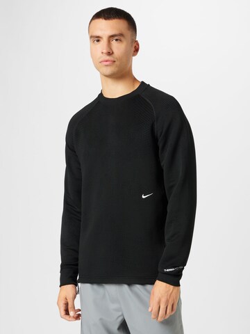 NIKE Sweatshirt i svart: framsida