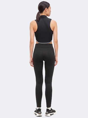 Skinny Pantalon de sport UNDER ARMOUR en noir