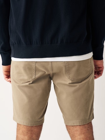 Next Slimfit Chinobyxa i grå
