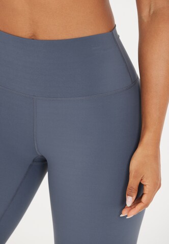 Athlecia Skinny Sportbroek 'Stay' in Blauw
