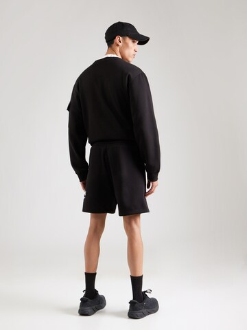 Reebok - Loosefit Pantalón deportivo 'NATE' en negro