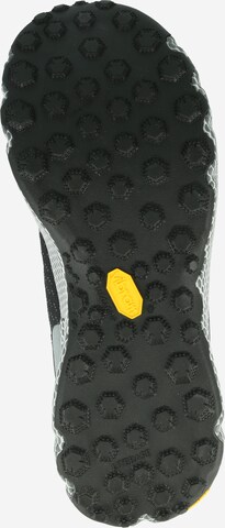 UNDER ARMOUR Running Shoes in Black