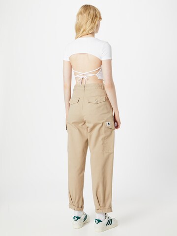 Carhartt WIP Tapered Gargohousut 'W' Collins Pant' värissä beige