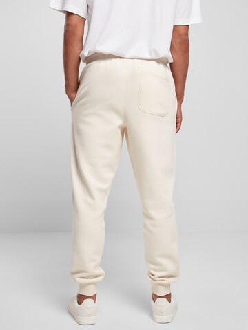 Tapered Pantaloni di Urban Classics in beige