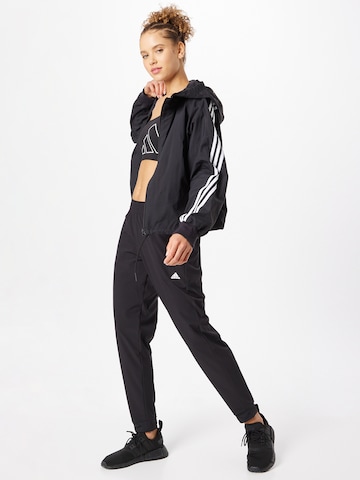 ADIDAS SPORTSWEAR Tapered Παντελόνι φόρμας 'Versatile Train ' σε μαύρο