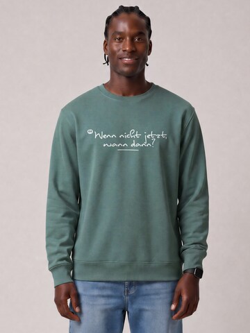 Watapparel Sweatshirt 'Wenn Nicht Jetzt Wann Dann' in Groen: voorkant